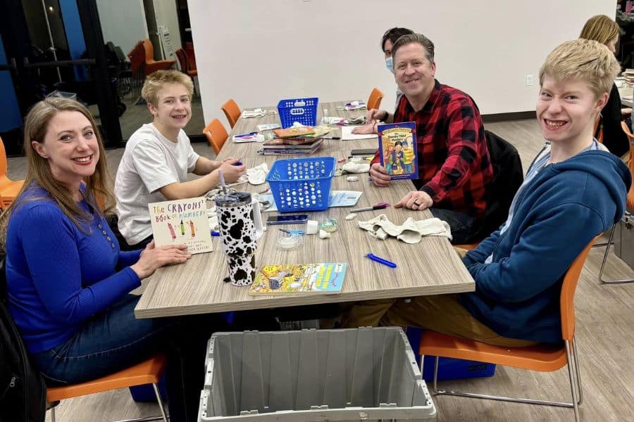 Rotary Club volunteers cleaning books at Spread the Word Nevada event
